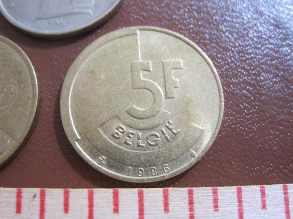 Lot of five Belgian coins: one 1960 20 centimes, two 5 francs (1974 & 77) and two 1986