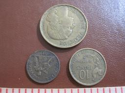 Three French coins: one 1923 50 centimes, one 1951 10 francs and one 1953 50 francs