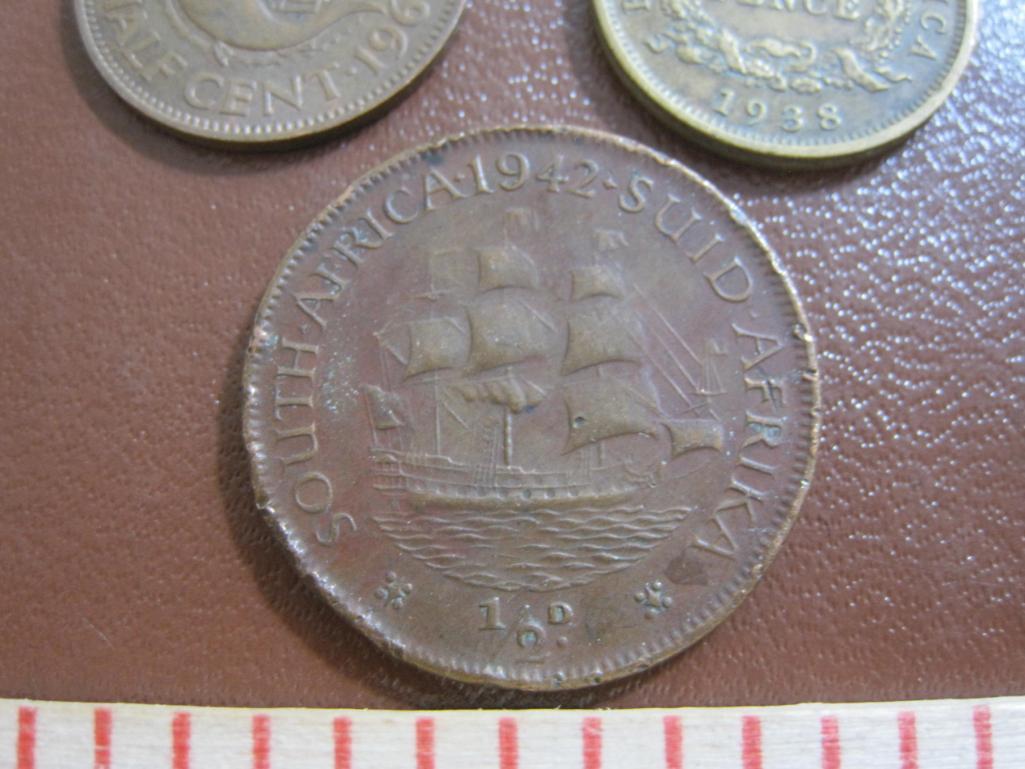 one 1938 British West Africa 6 pence, one 1964 Sierra Leone 1/2 cent and one bronze 1942 South