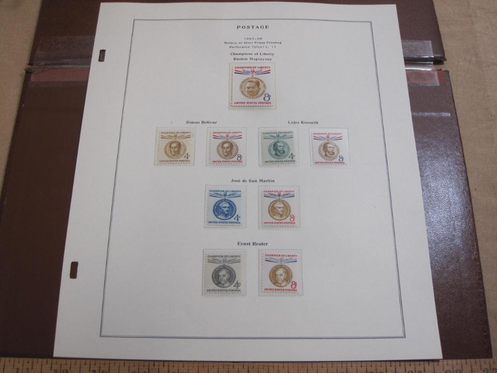 Completed official Scott album page including 1957-59 Champions of Liberty postage stamps; all