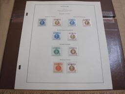 Completed official Scott album page including 1960-61 Champions of Liberty; all stamps are mounted