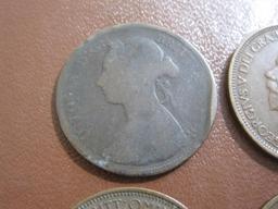 Lot of 4 Great Britain coins, including one 1887 Queen Victoria "bun head" half penny coin and three