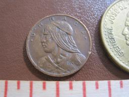 Two coins: one 1982 Republic of Panama un centesimo coin and one 1978 Argentina 50 pesos coin