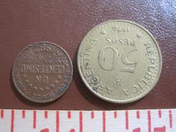Two coins: one 1982 Republic of Panama un centesimo coin and one 1978 Argentina 50 pesos coin
