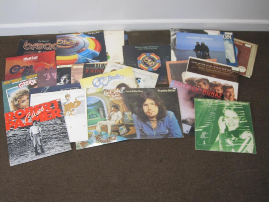 Lot of 25+ vinyl records including Robert Palmer, Mellencamp, Captain and Tennille, Meatloaf, ELO