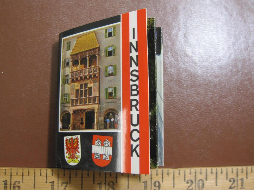 Three small postcard books: one "Der Rhein von Mainz bis Dusseldorf," one Innsbruck and one "Lac des