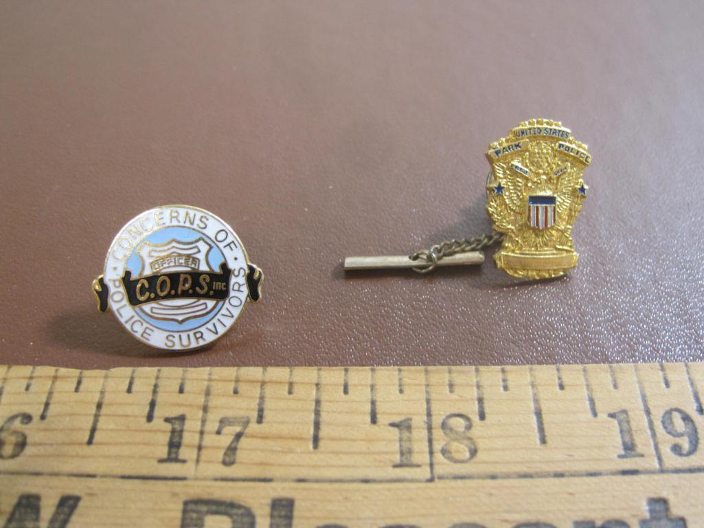 TWO police-themed pins, one US Park Police and one Concerns Of Police Survivors (C.O.P.S.)