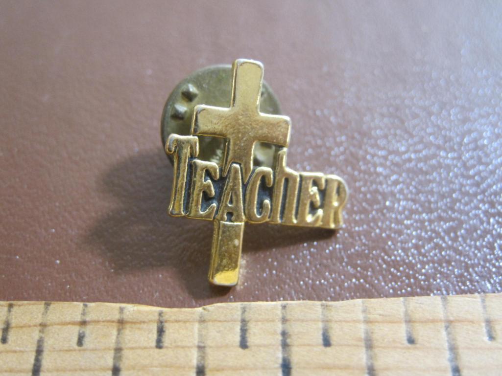 Lot includes four pins: one teacher with a cross behind it, one Prince George's County, one apply
