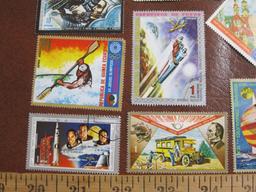 Lot of 16 colorful canceled Equatorial Guinea postage stamps with space and sports themes