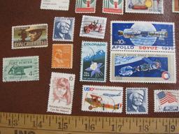 Lot of approximately TWO DOZEN miscellaneous cancelled US postage stamps including 1975 Pioneer