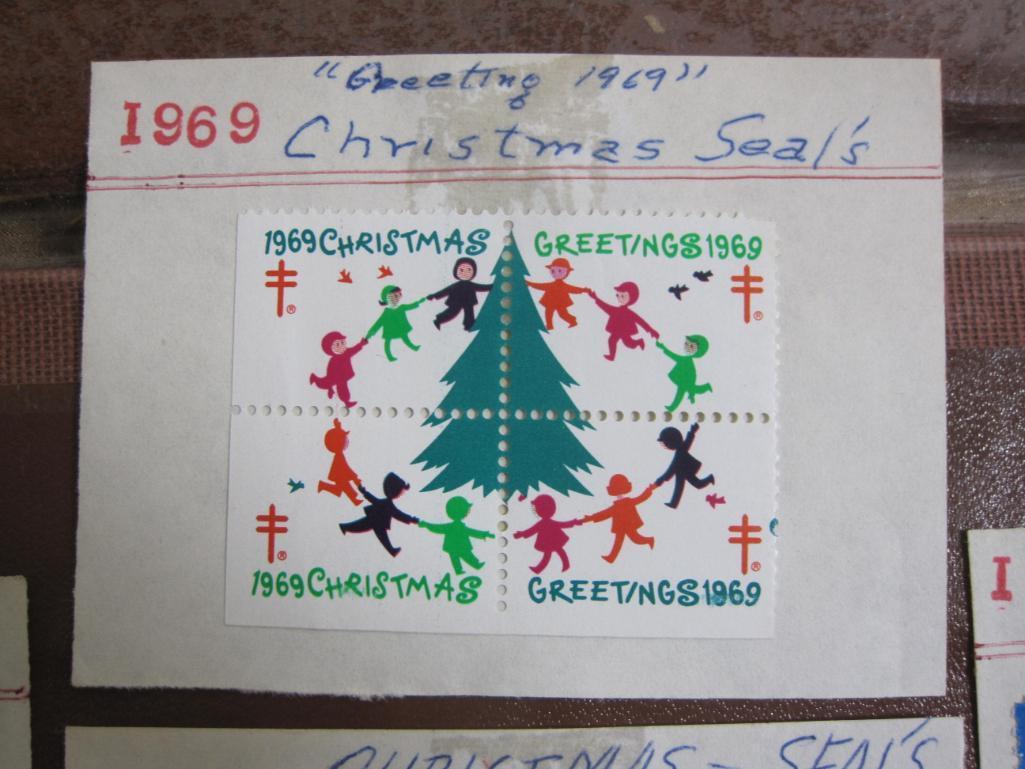Lot includes 11 American Lung Association US Christmas seals from 1960s-70s hinged on display cards;