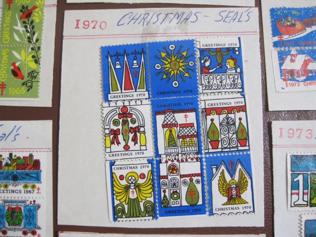 Lot includes 11 American Lung Association US Christmas seals from 1960s-70s hinged on display cards;