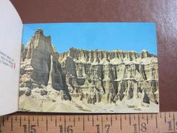 Four small South Dakota souvenir photo booklets (two on Badlands, one of the Black Hills and one of