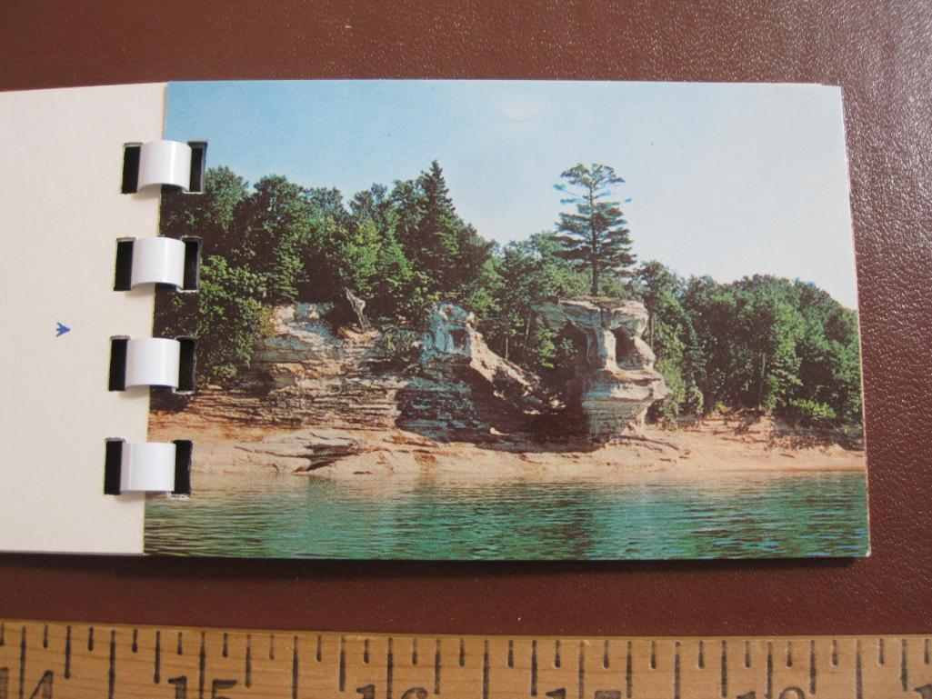 Four small souvenir photo booklets: two on Michigan's Upper Peninsula, one on the Mackinac Bridge