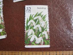 Lot of more than TWO DOZEN cancelled 1996 32 cent Snowdrop US postage stamps, Scott # 3028