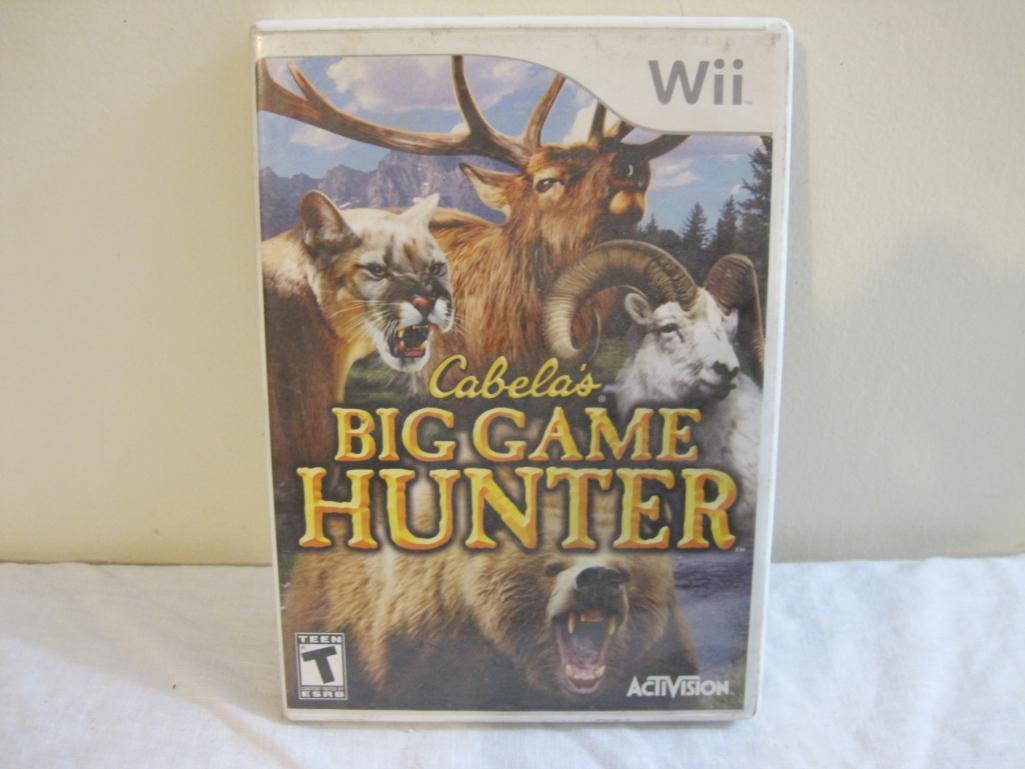 Lot of Wii Games including Just Dance 4, Transformers the Game, and Cabela's Big Game Hunter, all