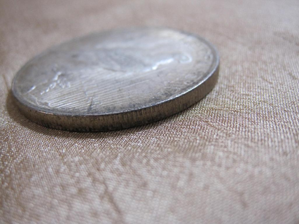 One 1922 Silver Peace Dollar, 26.7 g