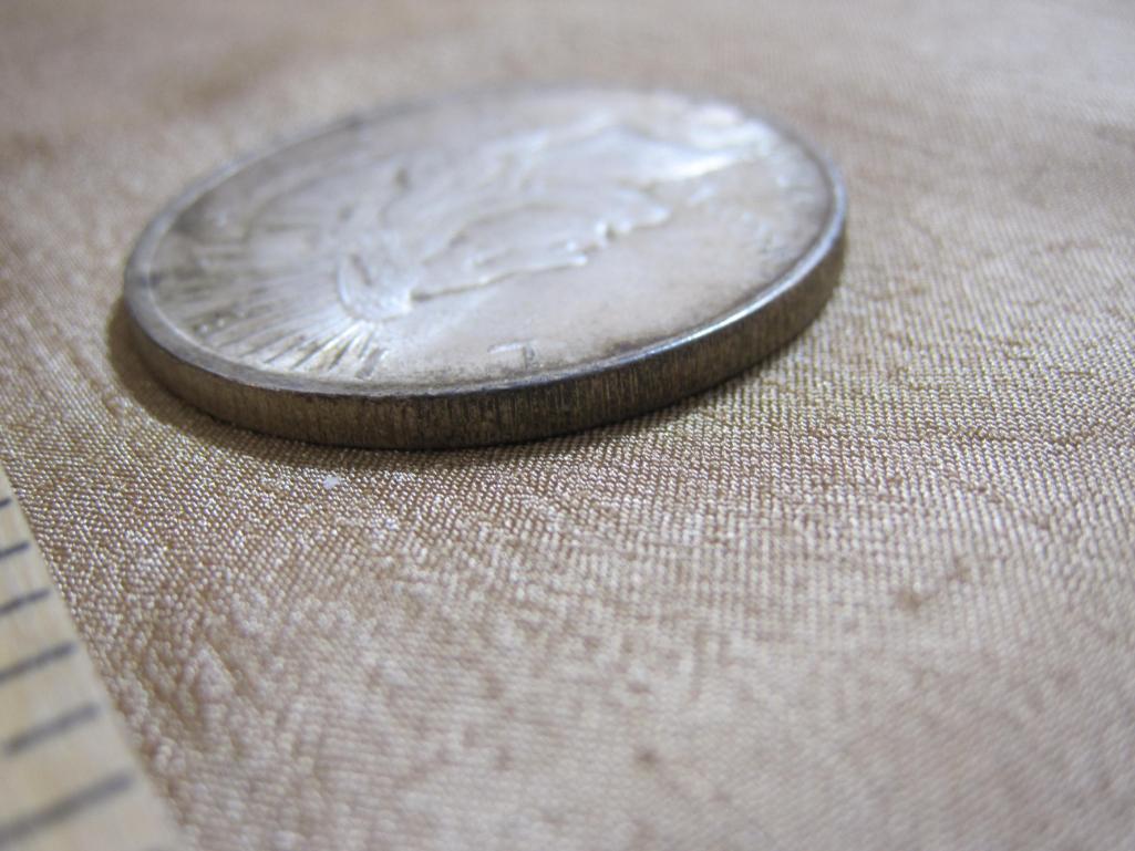 One 1922 Silver Peace Dollar, 26.7 g