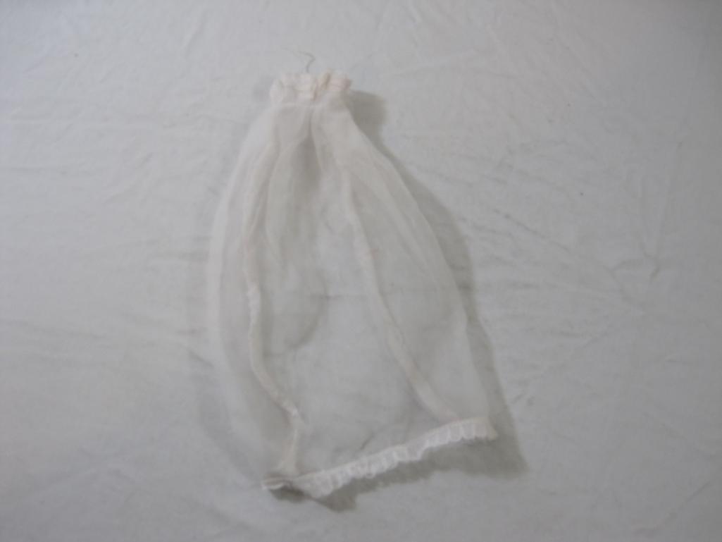 Lot of Vintage Barbie Clothes including Wedding Dress and Veil and many offical Barbie tagged items,