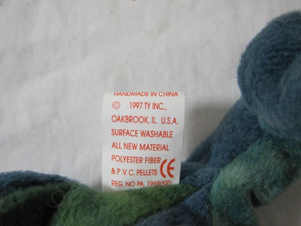 Four TY Beanie Babies including Rainbow (2 variations), Iggy, and Smoochy, all tags included and