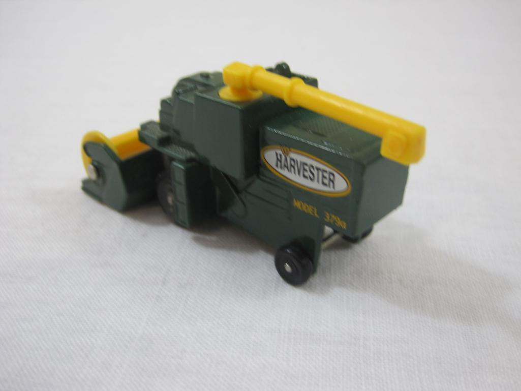 Six Assorted Matchbox Cars from 1970s-1990s including 1977 Harvester and more, 9 oz
