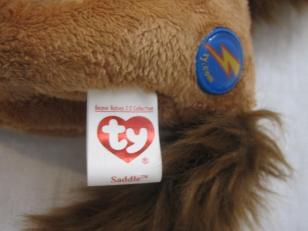 Lot of 5 TY Beanie Babies including Goochy, Jollu, Eggbert, Saddle 2.0 and Jumpshot, all tags