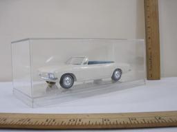 1965 White Chevrolet Corvair Promo Model Car, 2-Door Convertible with blue interior, in plastic