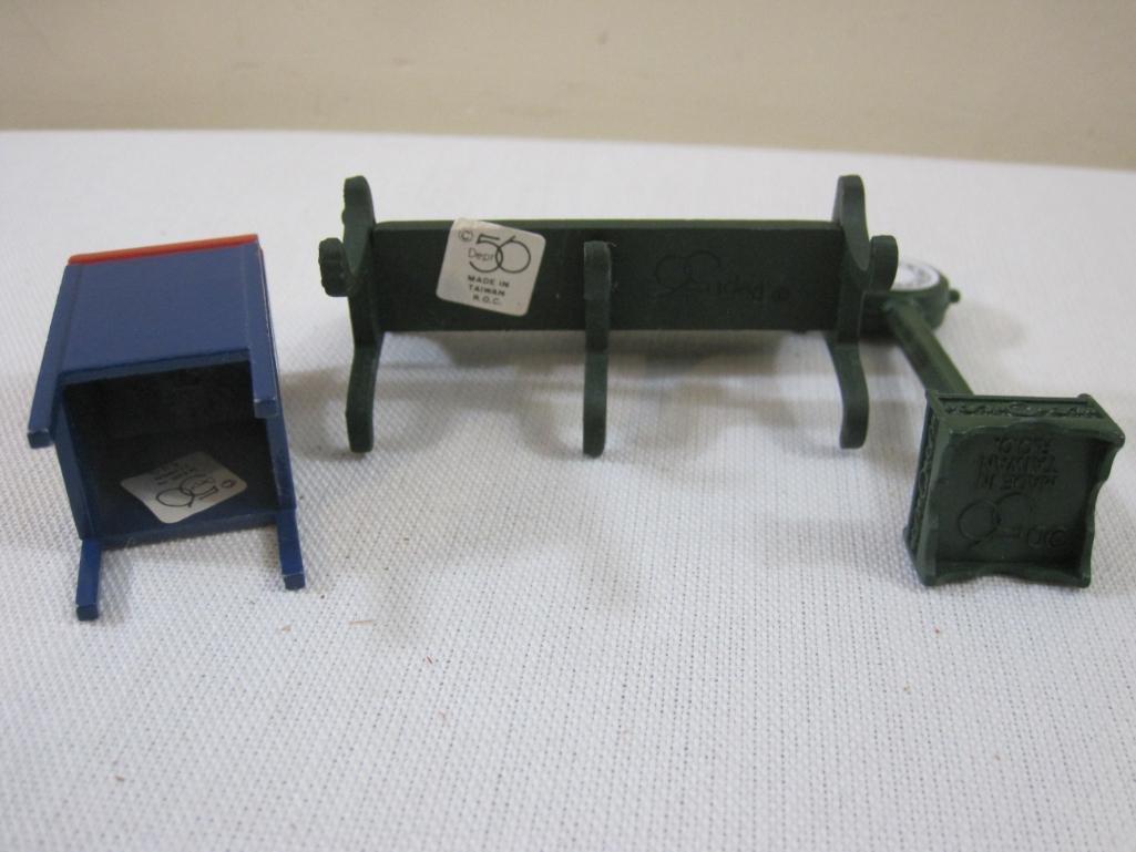 Three Department 56 Train/Christmas Display Accessories including clock, park bench, and US Mail