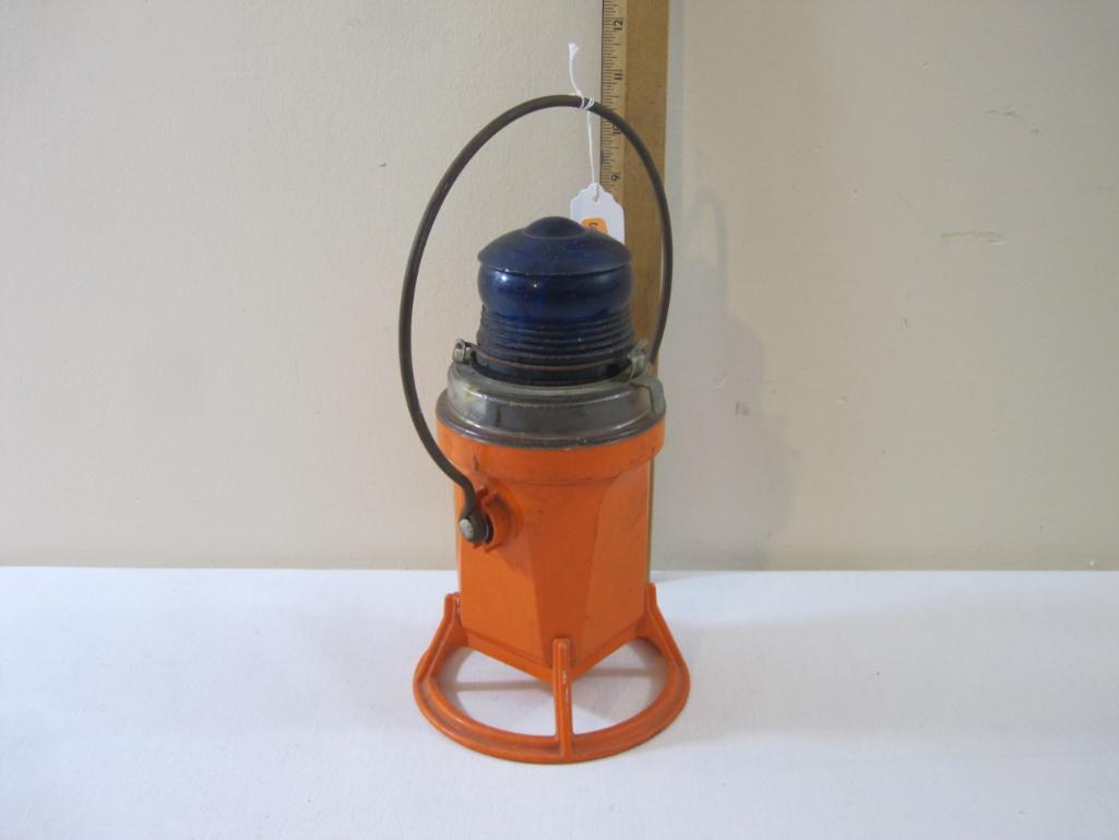 Vintage Hand Light, blue plastic globe with orange plastic base, 1 lb 5 oz