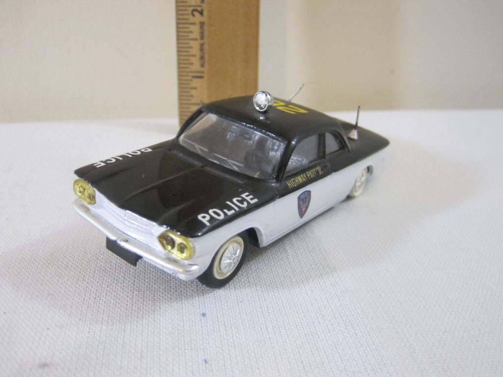 Two Diecast Chevrolet Corvairs including Elicor Police Car and Blue Corgi Toys, 6 oz