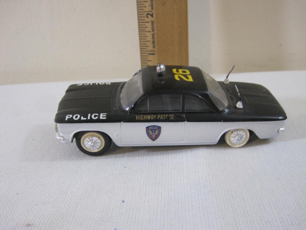 Two Diecast Chevrolet Corvairs including Elicor Police Car and Blue Corgi Toys, 6 oz