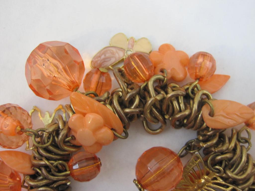 Four Vintage Bracelets including stretch and pink with butterflies and flowers, 6 oz