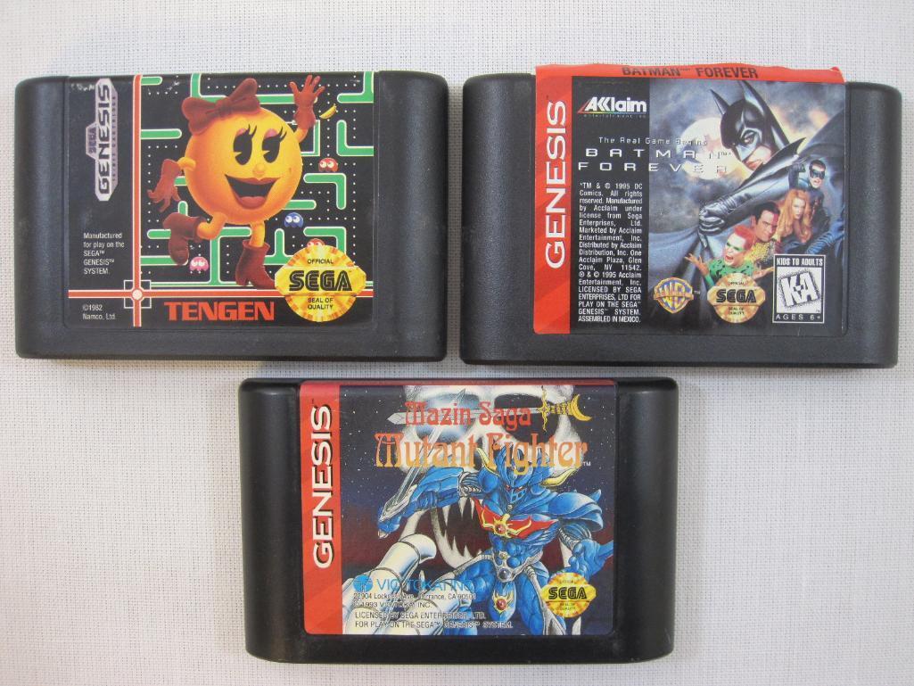 Three Vintage Sega Genesis Game Cartridges including Mazin Saga Mutant Fighter, Batman Forever, and