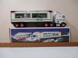 Two 1990s Hess Trucks including 1995 Toy Truck and Helicopter and 1997 Toy Truck and Racers, in