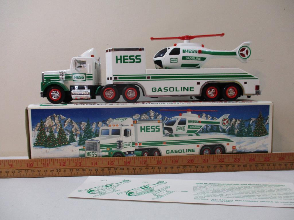Two 1990s Hess Trucks including 1995 Toy Truck and Helicopter and 1997 Toy Truck and Racers, in