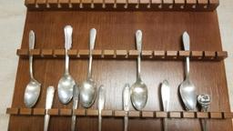 Wooden Display Rack, complete with 11 Spoons, Some Silver plate