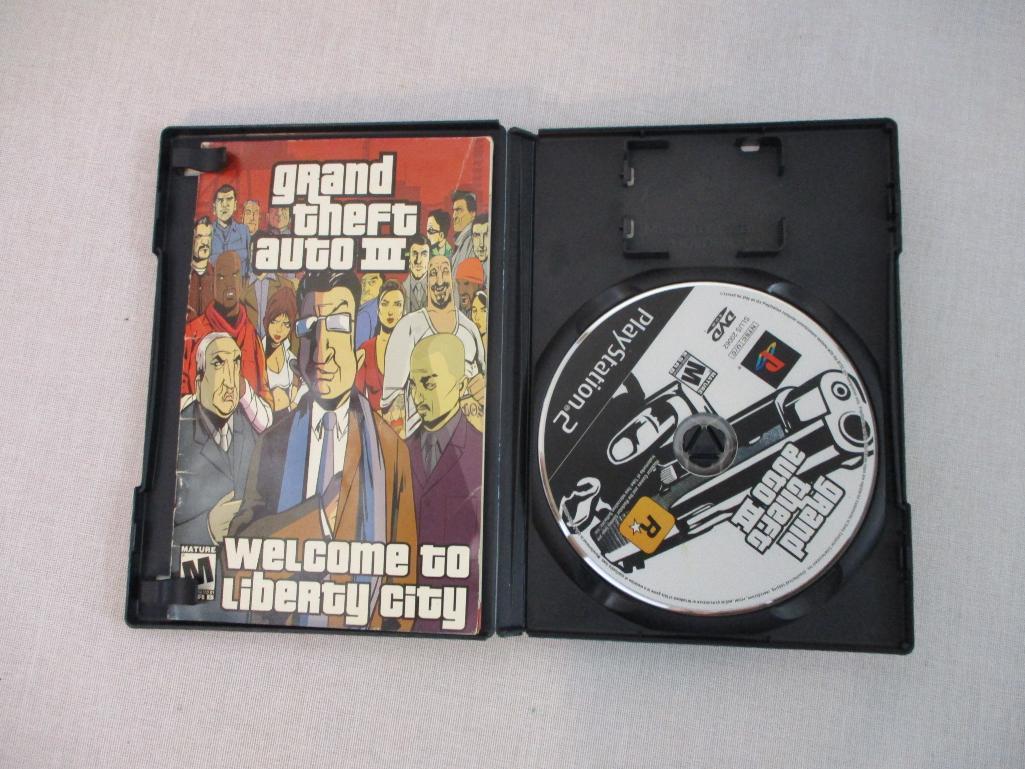 Three PS2 PlayStation 2 Games including Madden 2005, Grand Theft Auto III, and Dance Dance