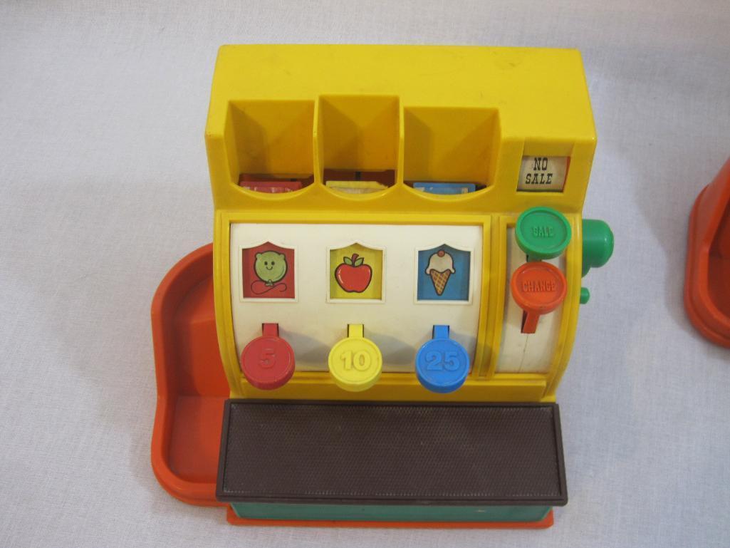 Two 1974 Fisher Price Cash Registers, tested and work, see pictures for cosmetic condition, 4 lbs 1