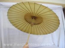 Folding Oil Papered Vintage Parasol, approximately 3 ft in diameter when open, has a tiny tear, see