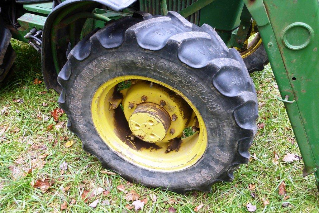 John Deere 2550 4 WD tractor (7314 hrs showing) with bucket-bush hog type mower NOT INCLUDED