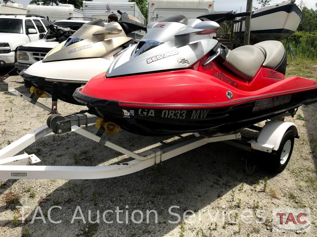 Two 2004 Sea-Doo/BRP GTX (4-Tec White/Gold and Wakeboard Edition Red/Silver)