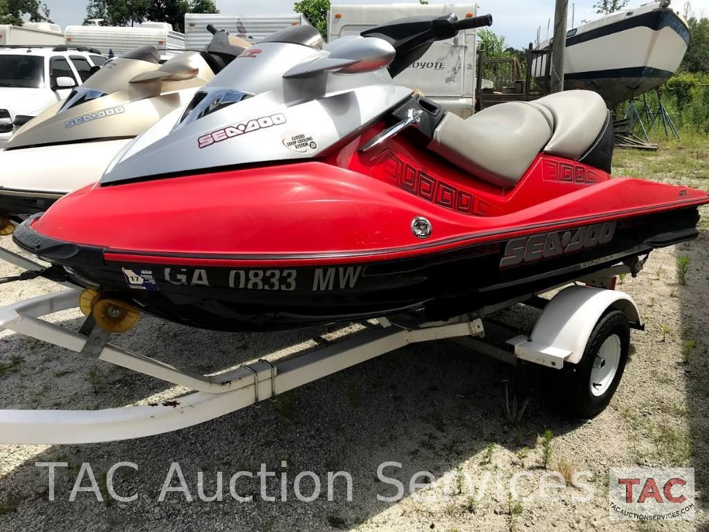 Two 2004 Sea-Doo/BRP GTX (4-Tec White/Gold and Wakeboard Edition Red/Silver)