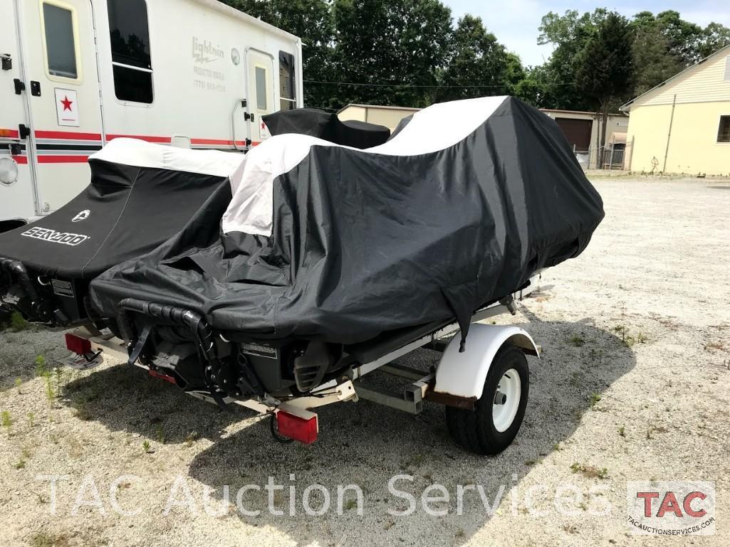 Two 2004 Sea-Doo/BRP GTX (4-Tec White/Gold and Wakeboard Edition Red/Silver)