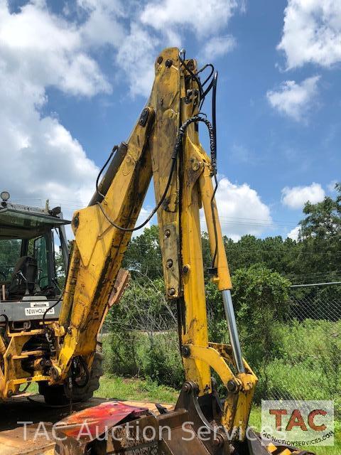 2001 New Holland 675E 4WD Loader Backhoe with 1995 Better Built 25 foot Pintle Hitch Tag A Long