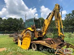 2001 New Holland 675E 4WD Loader Backhoe with 1995 Better Built 25 foot Pintle Hitch Tag A Long