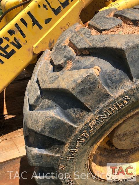 2001 New Holland 675E 4WD Loader Backhoe with 1995 Better Built 25 foot Pintle Hitch Tag A Long