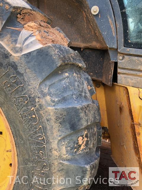 2001 New Holland 675E 4WD Loader Backhoe with 1995 Better Built 25 foot Pintle Hitch Tag A Long