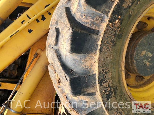 2001 New Holland 675E 4WD Loader Backhoe with 1995 Better Built 25 foot Pintle Hitch Tag A Long