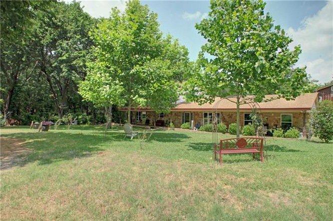 Tract 2: Single Family 6 Bedroom Brick Home with Garage Apartment and other improvements on 1 acre.