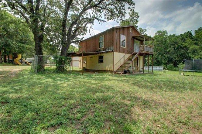 Tract 2: Single Family 6 Bedroom Brick Home with Garage Apartment and other improvements on 1 acre.